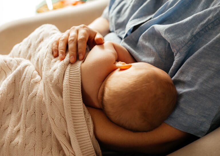 mother breastfeeding her infant baby